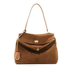 Echtleder Damen Umhaengetasche braun aus echtem Rindsleder freigestellt vor weissem Hintergrund