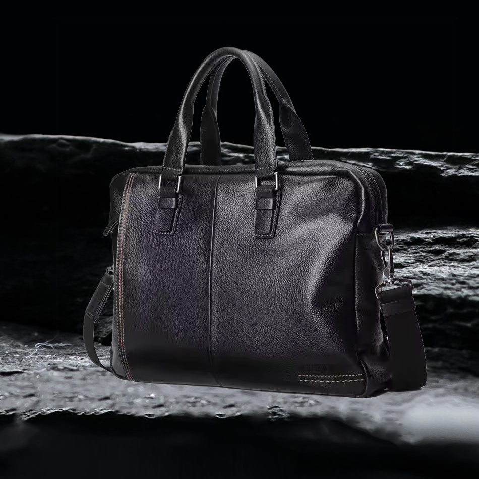 Herren Echtleder Tasche schwarz, hochwertige Business Ledertasche aus echtem Leder auf schwarzem Felsen frontal